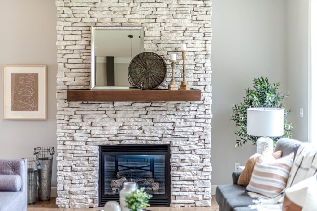 black fireplace in brown brick wall