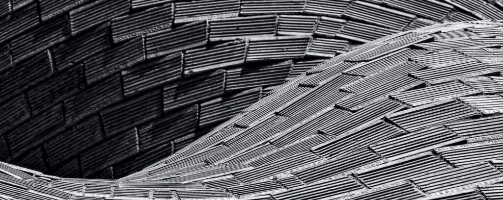 a black and white photo of a wooden structure