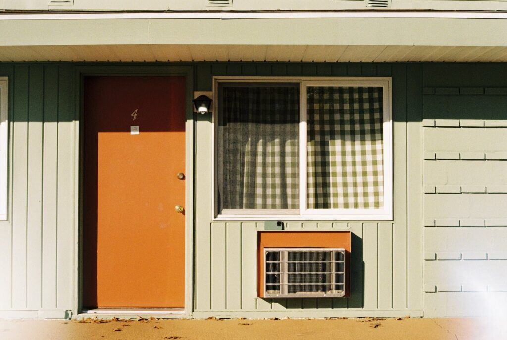 a house with a red door and a window